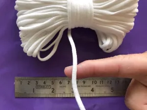 4mm flat, soft, ear loop elastic in WHITE for sewing masks. Sold in 10 and 20 yard bundles. Ships from Ohio.