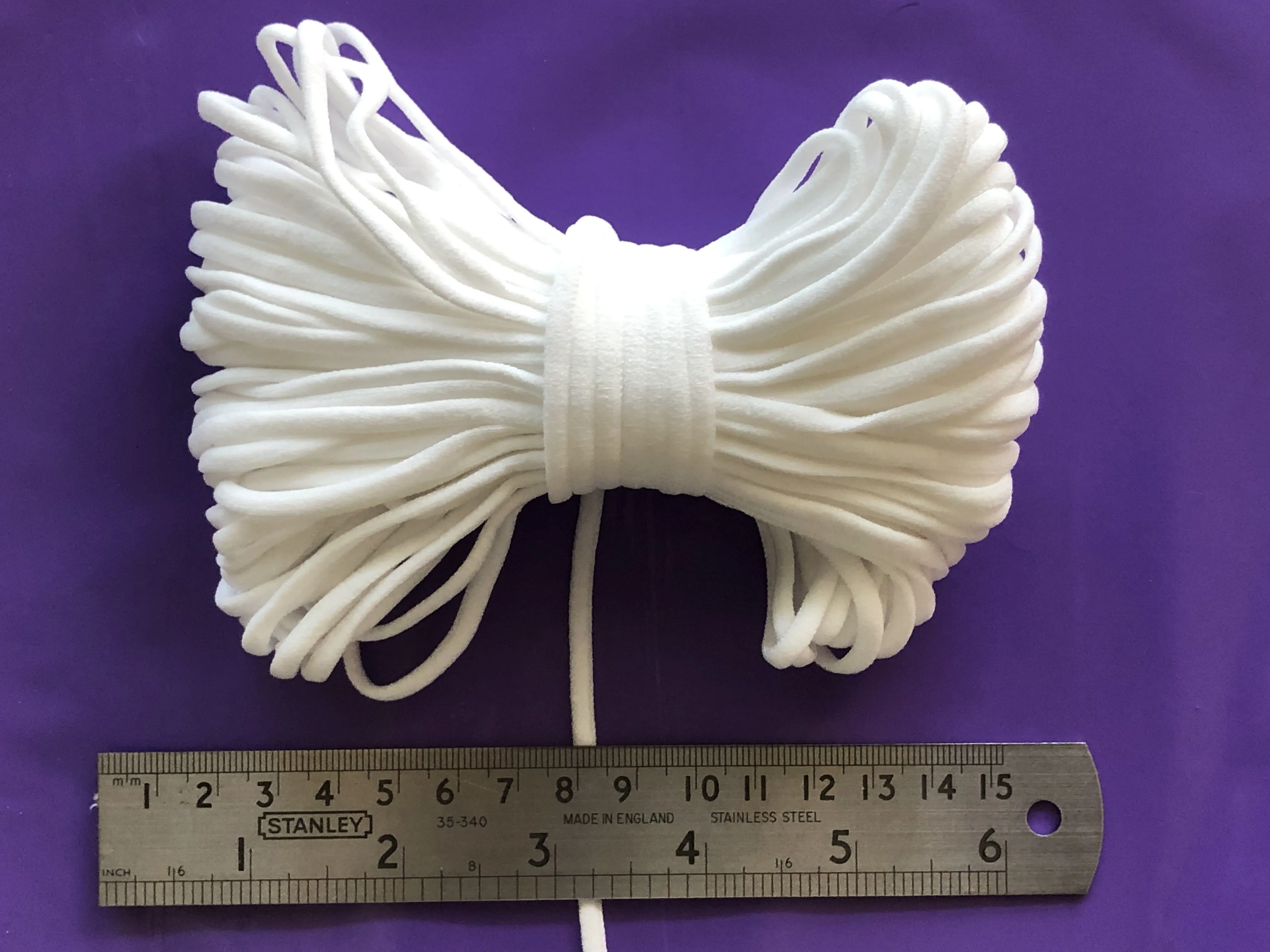 4mm flat, soft, ear loop elastic in WHITE for sewing masks. Sold in 10 and 20 yard bundles. Ships from Ohio.