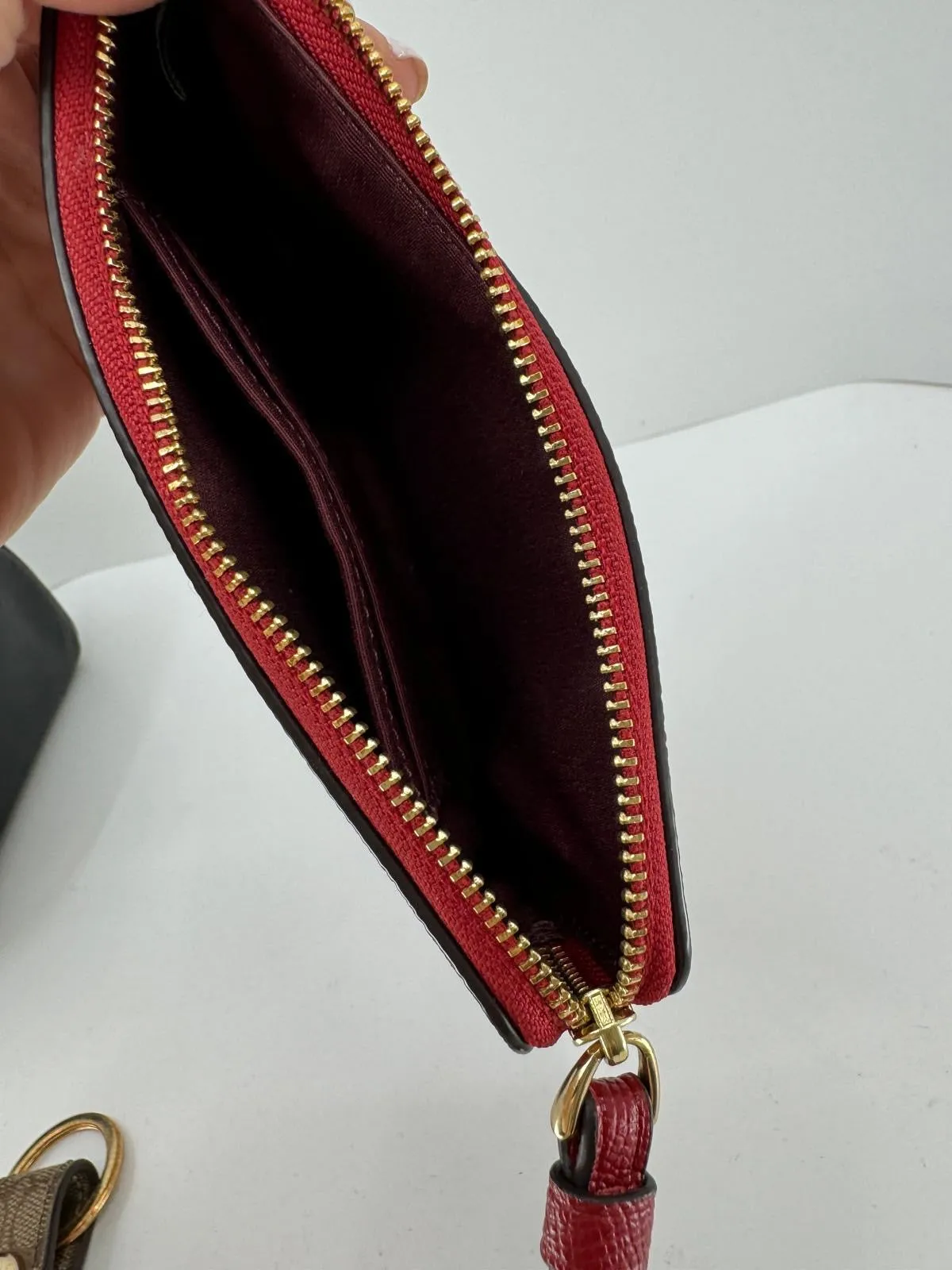 COACH PEBBLED LEATHER CORNER ZIP WRISTLET
