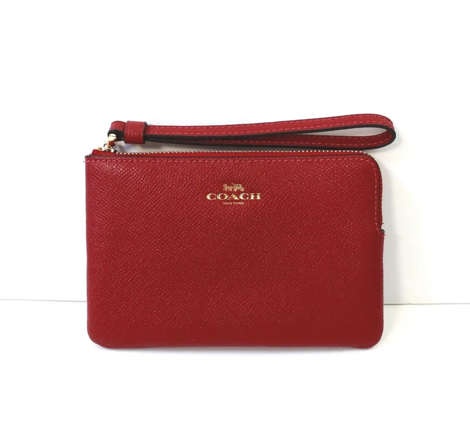 COACH PEBBLED LEATHER CORNER ZIP WRISTLET