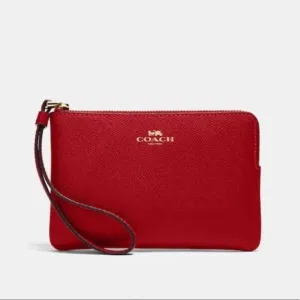 COACH PEBBLED LEATHER CORNER ZIP WRISTLET