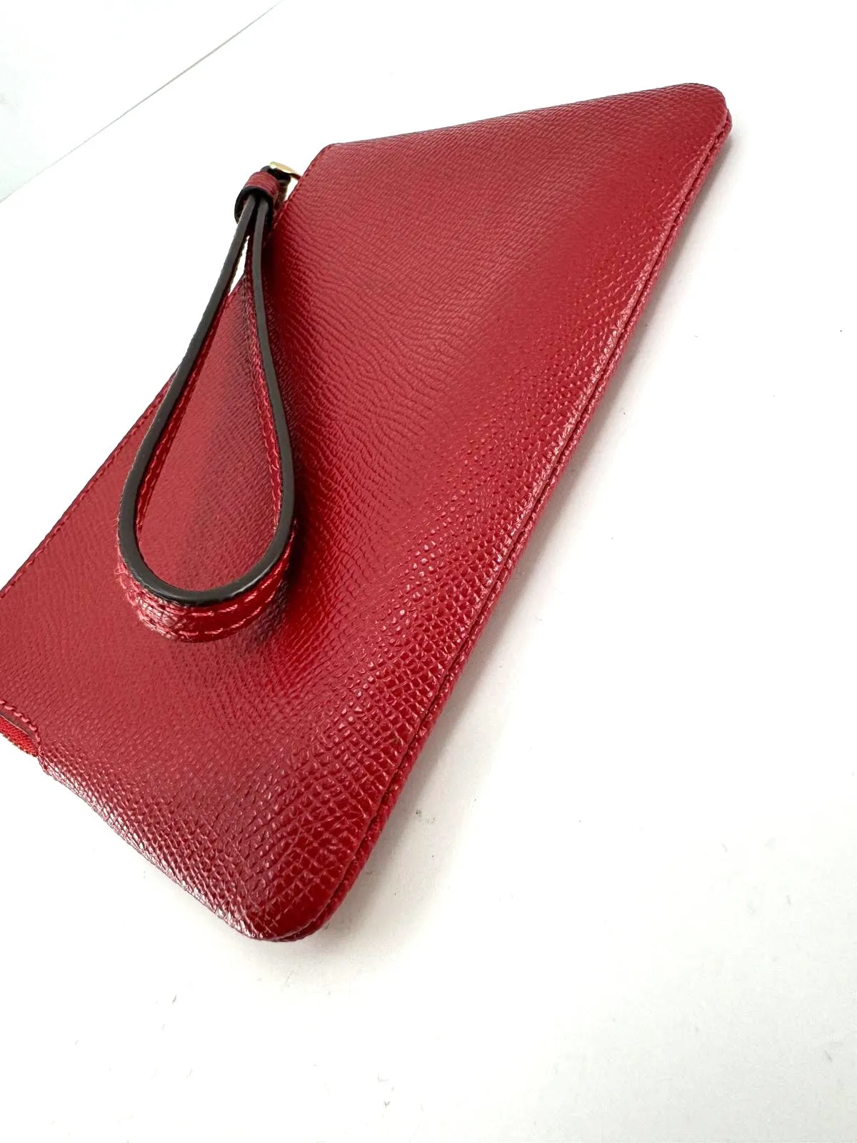 COACH PEBBLED LEATHER CORNER ZIP WRISTLET